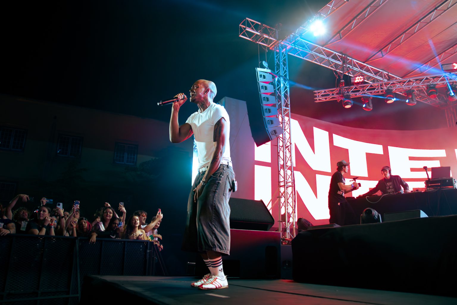Rapper singing at the edge of the stage