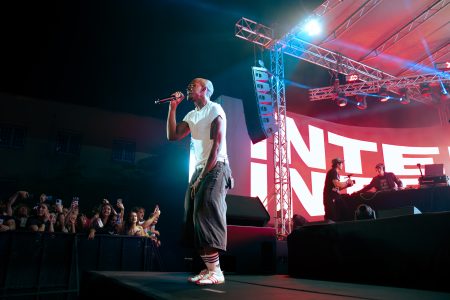 Rapper singing at the edge of the stage