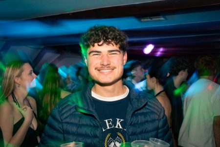 Smiling portrait of university student at a party.